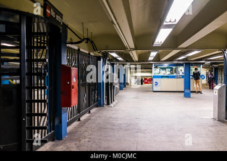 Bronx, USA - October 28, 2017: Empty subway station entrance with people walking in underground transit in NYC Fordham Road Heights Stock Photo