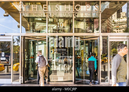 New York City, USA - October 28, 2017: Columbus Circle in Midtown Manhattan NYC, with entrance to shopping mall called Shops, doors, people entering b Stock Photo