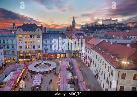 Bratislava - Christmas market on the Main square in evening dusk. Stock Photo