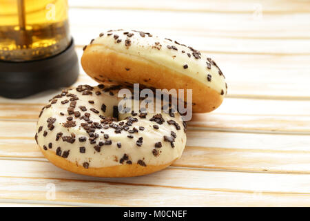 sweet donuts with sugar and chocolate colored glaze Stock Photo