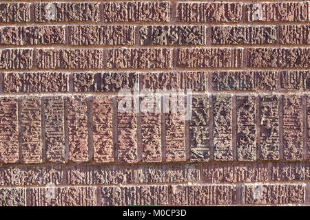 Textured brown brick wall background with unique stone pattern in shades of brown red and pink Stock Photo