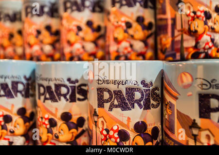 PARIS, FRANCE - JUNE 11, 2014: Disneyland souvenir mugs close