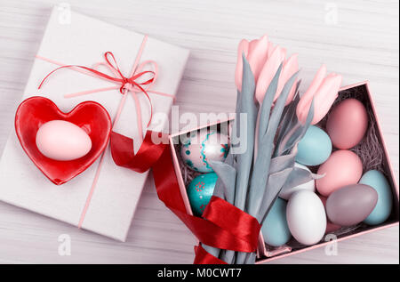 Colorful Easter Eggs and tulips decorated Stock Photo