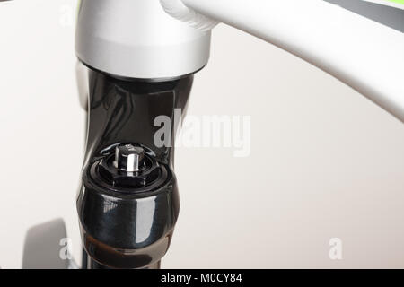 Air valve of suspension bicycle fork, close up view, studio photo. Stock Photo