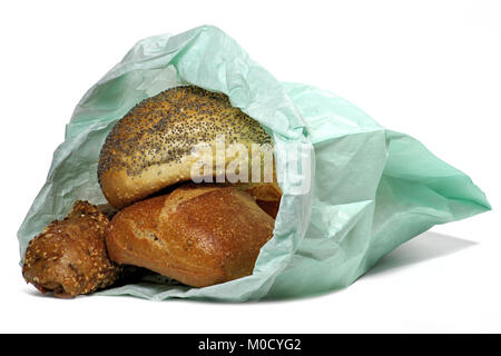 fresh German style bread rolls in paper bag isolated on white background Stock Photo