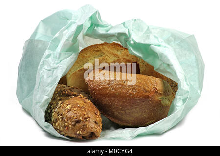 fresh German style bread rolls in paper bag isolated on white background Stock Photo