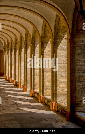 Sunlight through arches of medieval convent falling on stones Stock Photo