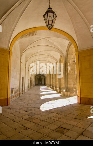 Sunlight through the arches of a corridor in a medieval cloister Stock Photo