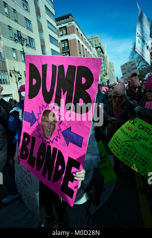 New York, USA. 20th Jan, 2018. Woman holds anti-Trump 'Dumb Blonde' sign. One year after the inauguration of President Donald Trump, women and men in cities acorss the U.S. protested against the president. Credit: Joseph Reid/Alamy Live News Stock Photo