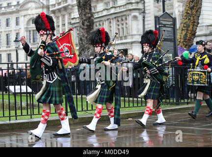 Student members of the Pipes and Drums band from Gordon's school in Surrey march to the statue of General Gordon of Khartoum in Whitehall Gardens, London, for a memorial service to commemorate his death. Stock Photo