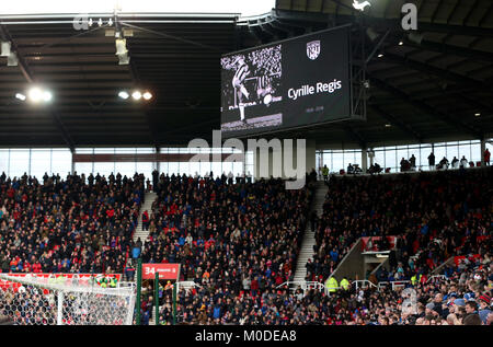 Fans and both teams observe a minute's applause in memory of the late Cyrille Regis before the Premier League match at the bet365 Stadium Stock Photo