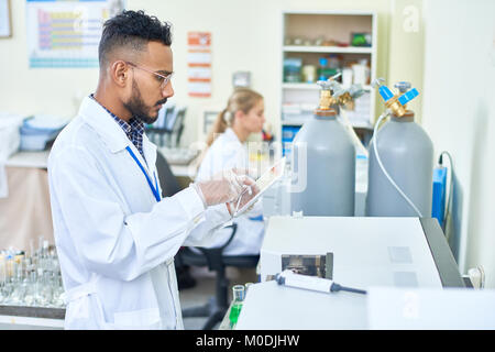Scientist Using Digital Tablet in Lab Stock Photo