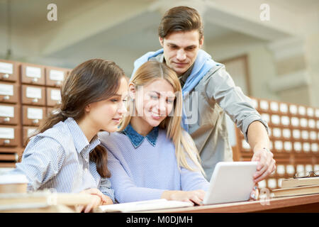 College Students Working on Joint Project Stock Photo