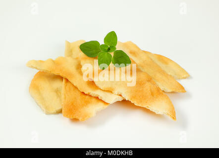 pieces of traditional Tuscan flatbread (Ghiottina Toscana) on white background Stock Photo