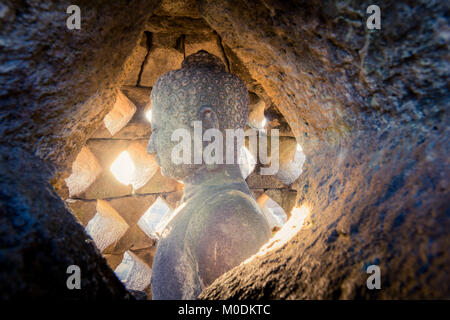 Buddha inside a stupa in Borobudur Stock Photo