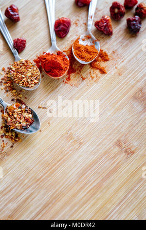 Various hot spices on a wooden background Stock Photo