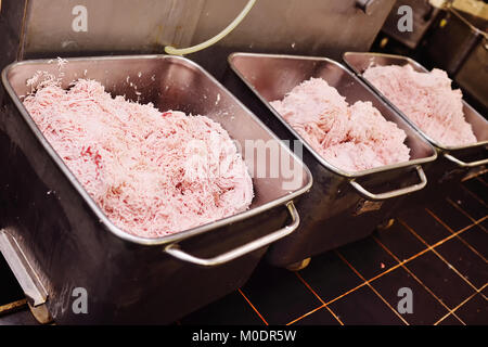 Processing Lard lard, pork or ground beef in metal containers in food production at a ...