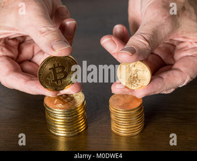 Comparison between gold and bitcoin as an investment Stock Photo