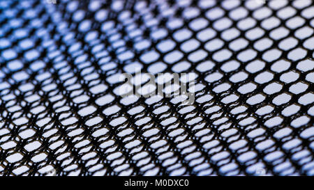 Abstract background from netting in black, white and blue. Artistic detail of hexagonal grid. Concept for science, research, technology and industry. Stock Photo