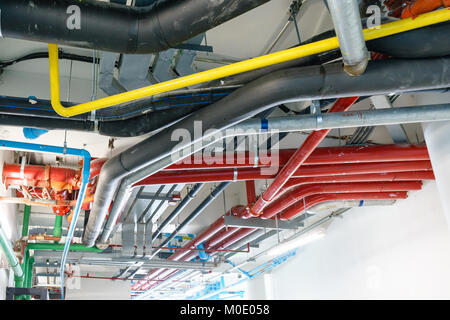 Red Water pipe system. Pumping systems for industrial plants. Construction work. Installation of pipeline extinguishing water in the building. Mainten Stock Photo