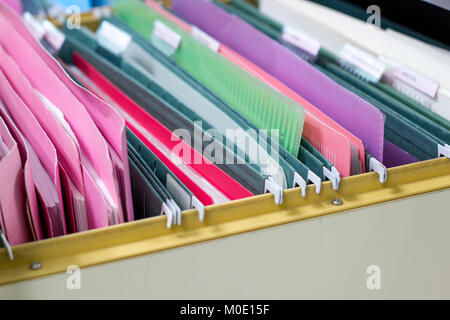 Files document of hanging file folders in a drawer in a whole pile of full papers, at work office Bangkok Thailand Business Concept Stock Photo