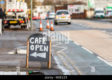 Day view Cafe Open wooden sign on sidewalk. Stock Photo