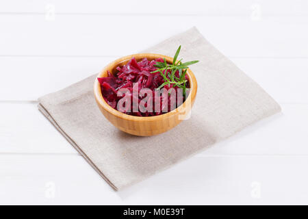 bowl of pickled red cabbage on beige place mat Stock Photo