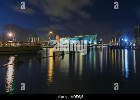 Amsterdam, Netherlands, December 16, 2017: The illuminated Nemo Science Museum along the Oosterdok canal in Amsterdam Stock Photo