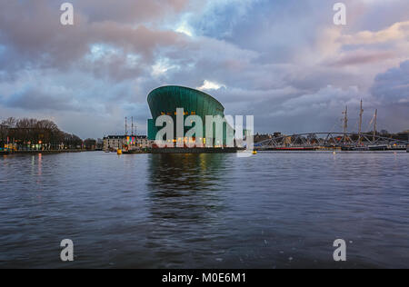 Amsterdam, Netherlands, December 16, 2017: Nemo Science Museum with in the background the Maritime Museum in Amsterdam Stock Photo