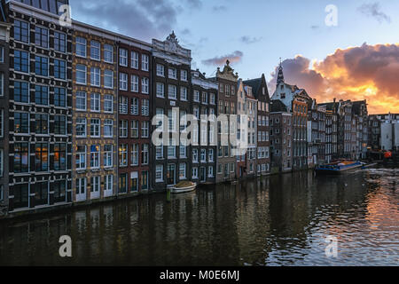 Amsterdam, Netherlands, December 16, 2017:  The characteristic canal houses on the Damrak in the old town of Amsterdam Stock Photo
