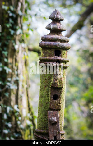 Old rusty metal gate post Stock Photo