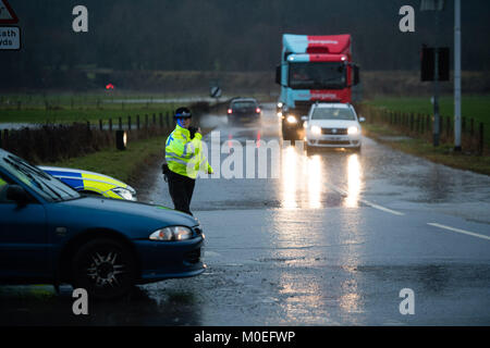 Llandre, Ceredigion Wales, Sunday 21 January 2018  Bow Street, Aberystwyth, Ceredigion Wales UK  UK Weather: Police control traffic after floodwaters inundate the main road through Bow Street on the outskirts of Aberystwyth in Mid Wales after hours of torrential rain   photo © Keith Morris / Alamy Live News Stock Photo