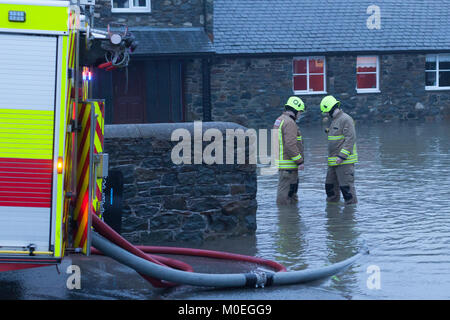 fire crew pumping flooded water from the car park of Pennau craft and coffee shop in Rhydypennau, mid Wales. © Ian Jones/Alamy Live News. Stock Photo