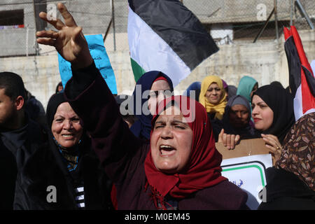 Gaza. 21st Jan, 2018. Palestinian refugees protest in front of a United Nations Relief and Works Agency for Palestine Refugees (UNRWA) distribution center in the southern Gaza Strip city of Rafah, on Jan. 21, 2018. The UNRWA will launch on Monday a funding campaign to face its budget deficit, a UNRWA official said on Sunday. Credit: Khaled Omar/Xinhua/Alamy Live News Stock Photo