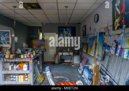 View through the window of "Nigel Cooke Art Gallery & Studio",  Huddersfield Road, Holmfirth, West Yorkshire. A working art studio, shop and gallery. Stock Photo