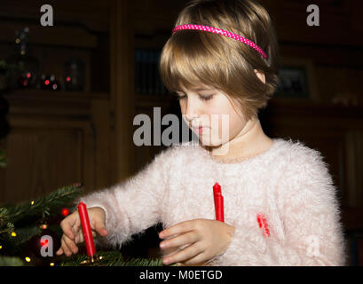 Decorating a Christmas tree Stock Photo
