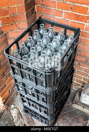 Milk bottles in crates, RGS, London, UK Stock Photo