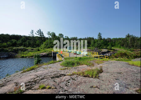 The Little Chaudiere dam is one of three dams controlling the water form Lake Nipissing to the french River Stock Photo