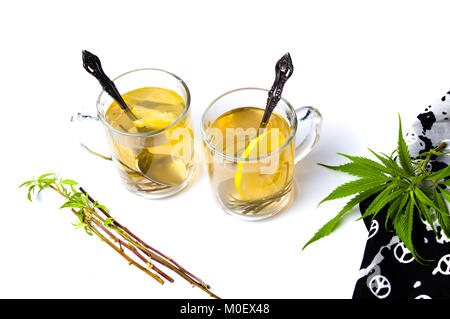 Marijuana tea and branches isolated on white Stock Photo