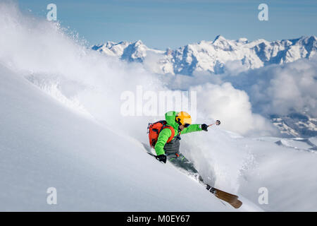 Man skiing in fresh powder snow, Alps, Kitzsteinhorn, Salzburg, Austria Stock Photo