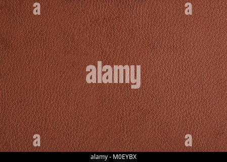 Brown leather material pattern close-up. Brown cow skin background Stock Photo