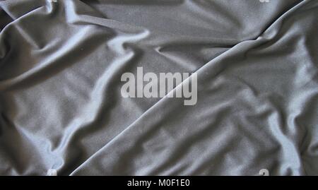 Black creased material background or texture Stock Photo
