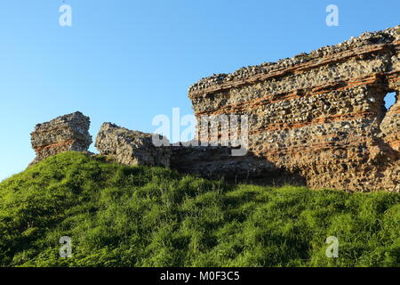 Huge Roman fortress walls built around 300AD at Burgh Castle to defend Norfolk, England, from raids by Saxon forces. Stock Photo