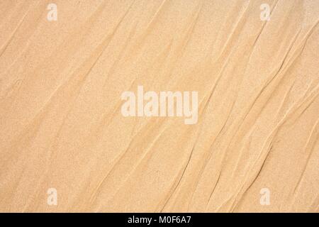 Beach background sand waves. Abstract orange texture. Stock Photo