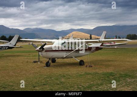 QUEENSTOWN, NEW ZEALAND - FEBRUARY 28, 2008: General aviation aircraft at Queenstown Airport, New Zealand. Queenstown Airport has 1,409,663 annual pas Stock Photo