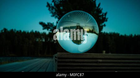 Reflection of Tree in Crystal Ball on Beautiful Autumn Evening with Great Colors Stock Photo