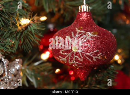 Happy Holidays, soft light hug the ornament decorated tree. Stock Photo