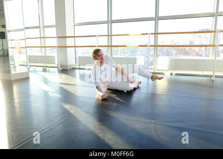 Guy doing drinking water before morning training.  Stock Photo