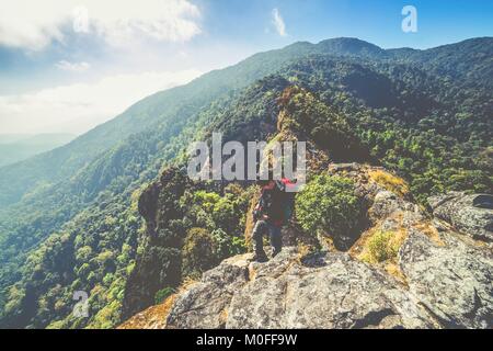 Man Traveler with big backpack hiking mountains expedition Travel Lifestyle success concept adventure active vacations outdoor mountaineering sport Stock Photo