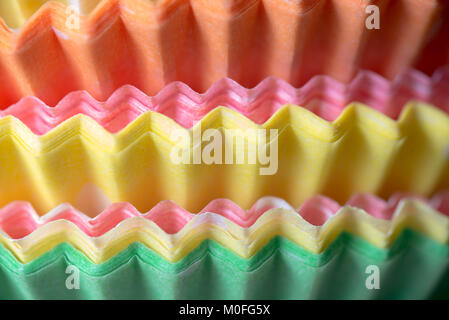 multicolored paper baking cups for cupcakes or muffins closeup Stock Photo